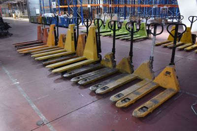 many pallets that are lined up in a warehouse