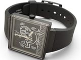 a wrist watch with a black band and a picture of a cartoon character on it