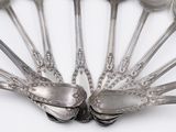 a lot of spoons that are sitting on a table