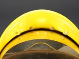 a close up of a yellow fire hydrant with a black background