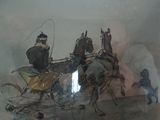 un tableau représentant une calèche tirée par deux hommes