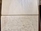 someone is drawing a picture on a piece of paper on a table