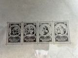four different stamps on a piece of paper with a black and white image
