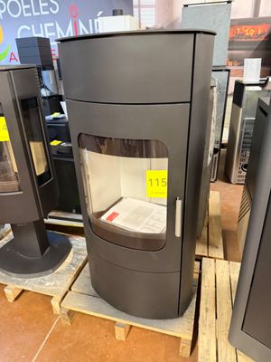 two stoves that are on pallets in a store