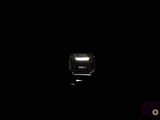 a light that is on in the dark of the room