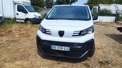 a white van that is parked in the dirt
