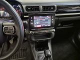 a dashboard of a car with a steering wheel and dashboard controls