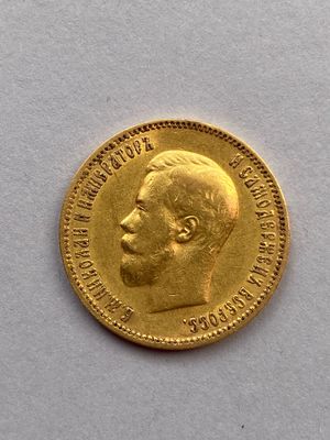 l'image d'une pièce d'or sur laquelle figure le visage d'un homme