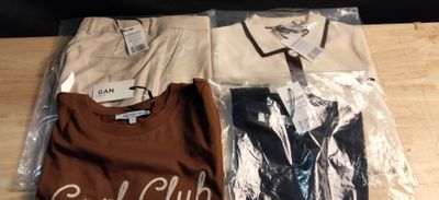 two men ' s shirts are wrapped in plastic on a table