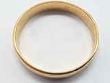 an image of a close up of a gold ring on a white surface