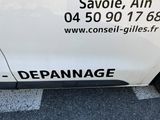 the side of a white van with a sticker on the side of it