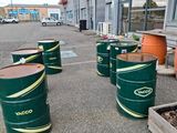 many barrels that are sitting in the parking lot