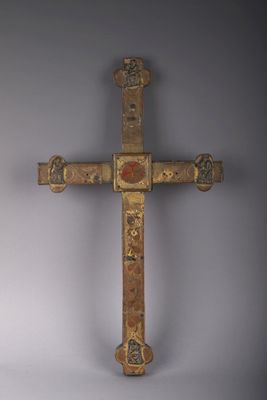 an old wooden cross with a decorative design on it