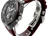 a close up of a watch on a white surface