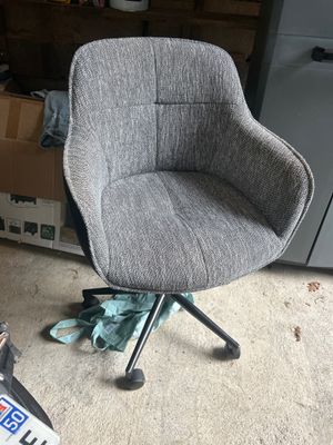 a chair that is sitting in the middle of a room