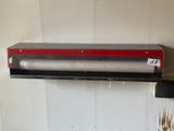 an image of a paper towel dispenser hanging on a wall