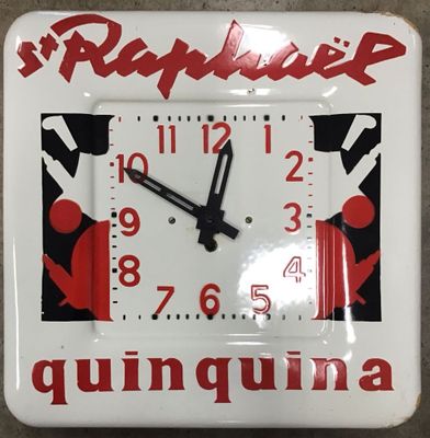 une horloge blanche ornée d'un motif rouge et noir