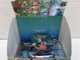 a box of pokemon trading game cards in a display case