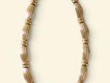 an image of a necklace made out of bamboo sticks on a white surface