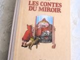 un livre sur lequel figure l'image d'un chat et d'un chien