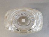 a clear glass object with a hole in the middle of it