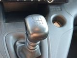 a close up of a car ' s dashboard with a gear stick