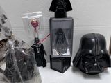 a lot of darth vader items on the table
