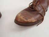 a close up of a pair of shoes on a white surface