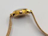 an image of a close up of a watch with a chain around it