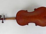 an old violin on a white surface with a white background