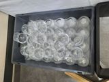 a box full of empty plastic water bottles on a table