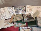 a lot of stamps on a table with a book on it
