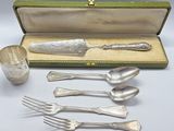 a silverware set with spoons and forks in a case