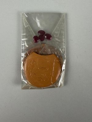 a chocolate cookie in a plastic bag on a table