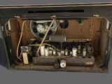an old machine that is sitting inside of a box