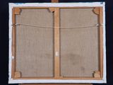 an easel with a piece of fabric on top of it on a black background