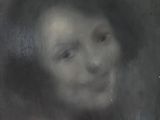 tableau représentant le visage d'une femme dans un cadre noir et blanc