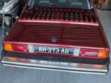 a red car that is parked in a garage