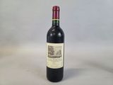 a bottle of wine that is sitting on a table