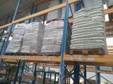a large amount of bags on the shelves in the warehouse
