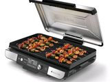 une photo d'un barbecue sur lequel cuisent des aliments