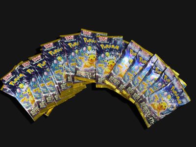 a lot of pokemon cards on a black background