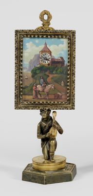 statue of a man holding a picture on a stand with a painting on it