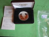 a small box with a coin in it on a table