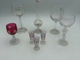 a lot of wine glasses that are sitting on a table