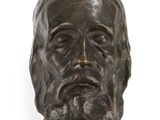the head of a statue of a man with a beard