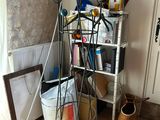 a picture of a room with a rack of scissors and other items