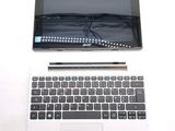 a laptop and a tablet on a white table
