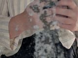 a woman taking a picture of herself in the mirror