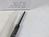 a picture of a knife that is laying on a table